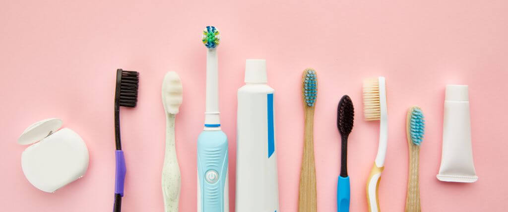 Line of toothbrushes in different shapes and sizes, part of dental care